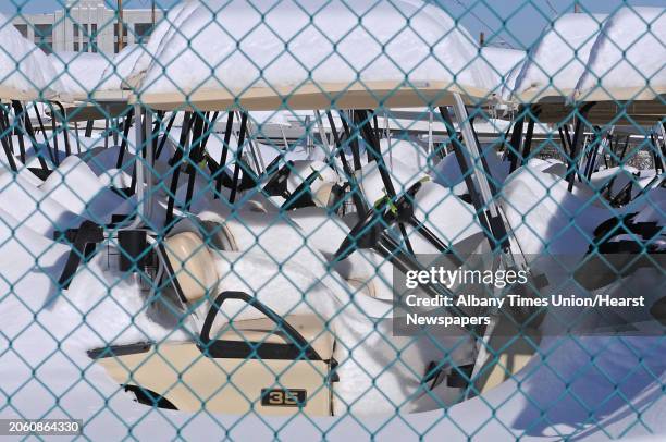 Lot of full of snow coverd golf cars in Menands, NY on February 4, 2011.