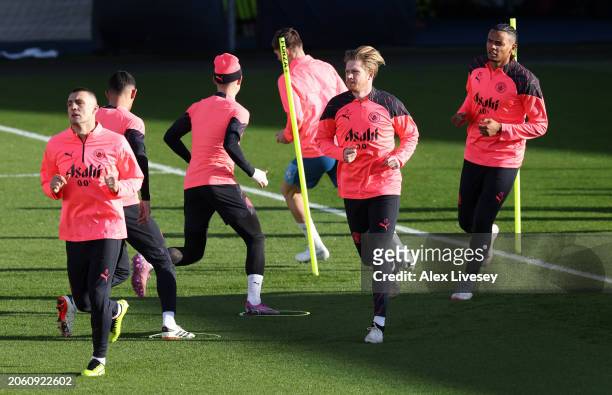 Kevin De Bruyne of Manchester City warms up during a training session at Manchester City Football Academy on March 05, 2024 in Manchester, England.