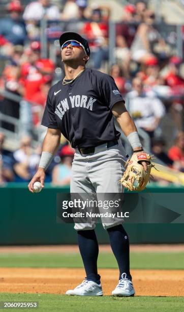 New York Yankees shortstop Oswald Peraza looking to the sun after dropping a short pop up hit by Philadelphia Phillies Trea Turner in the second...