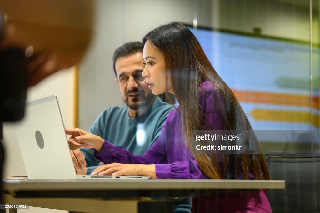 Business people working on laptop