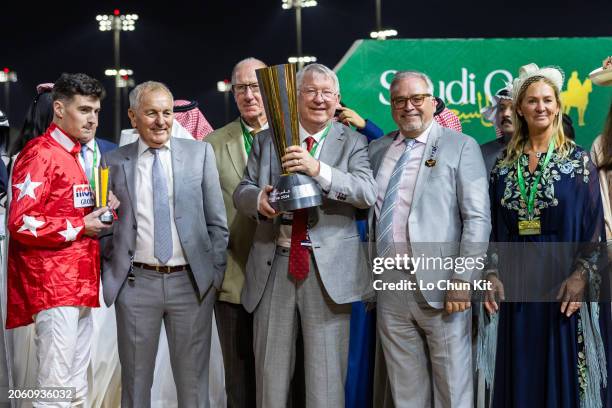 Jockey Oisin Orr, owners Peter Done, Sir Alex Ferguson and Ged Mason celebrate after Spirit Dancer winning the Neom Turf Cup at King Abdulaziz...