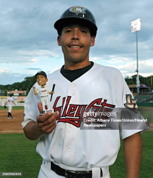 Batboy Charlie Constantino holds a bobblehead made in his honor for his 300th game at the ValleyCats baseball game against Mahoning Valley at the Joe...