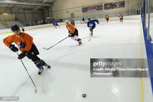 Men play in an adult men's hockey league game at Albany County Hockey Rink in Albany, N.Y. Wednesday, Oct. 5, 2011.