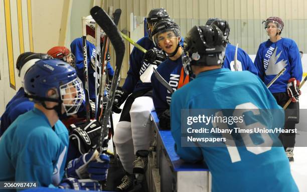 Men chat with each other before an adult men's hockey league game at Albany County Hockey Rink in Albany, N.Y. Wednesday, Oct. 5, 2011.