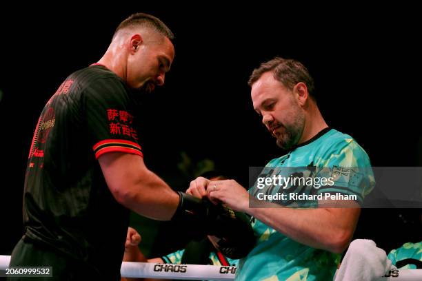 Trainer Andy Lee ties the gloves for Joseph Parker during a media workout ahead of the WBO Interim World Heavyweight Title fight between Zhilei Zhang...