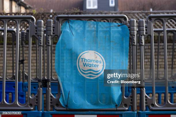 Thames Water Ltd. Company logo on protective barriers in London, UK, on Wednesday, March 6, 2024. Thames Water is waiting for a verdict on whether it...