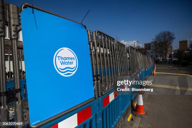 Thames Water Ltd. Company logo on protective barriers in London, UK, on Wednesday, March 6, 2024. Thames Water is waiting for a verdict on whether it...