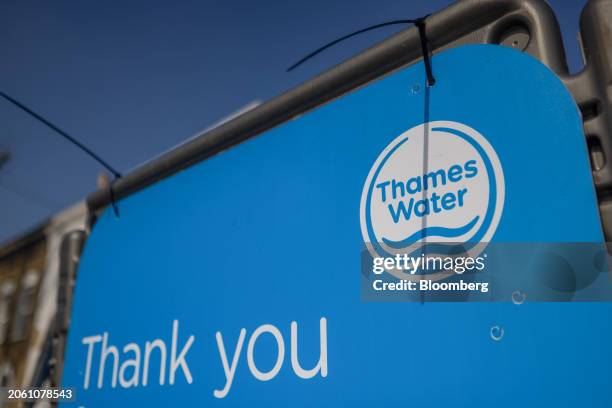Thames Water Ltd. Company logo on protective barriers in London, UK, on Wednesday, March 6, 2024. Thames Water is waiting for a verdict on whether it...