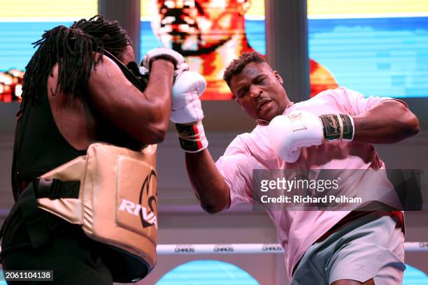 Francis Ngannou trains with his trainer Dewey Cooper during a media workout ahead of the Heavyweight fight between Anthony Joshua and Francis Ngannou...
