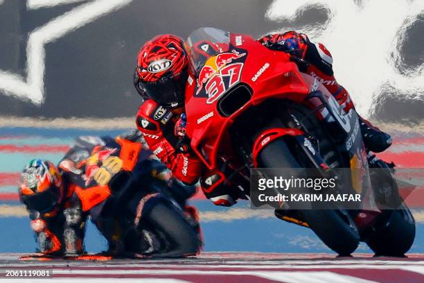 Red Bull GASGAS Tech3 Spanish rider Augusto Fernandez and Red Bull KTM Factory Racing South African rider Brad Binder steer their bikes during the...