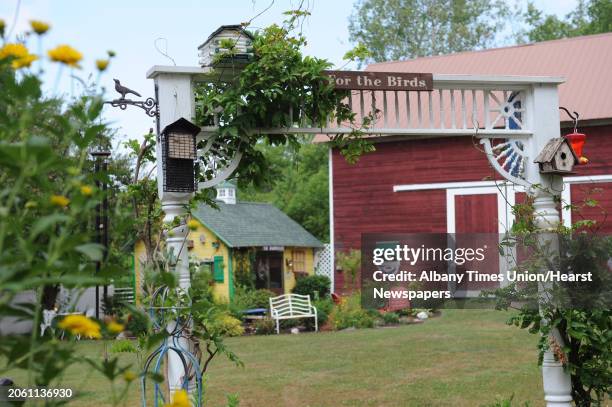 Trellis with birdhouses in Donna Lussier's garden in her back yard on Monday, July 16, 2012 in Voorheesville, N.Y.