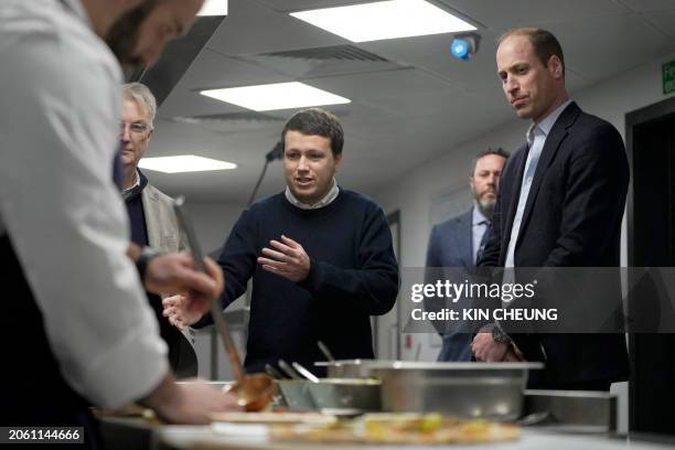 Britain's Prince William, Prince of Wales looks on as Pierre-Yves Paslier founder of Notpla explains the sustainable seaweed-based food plates during...