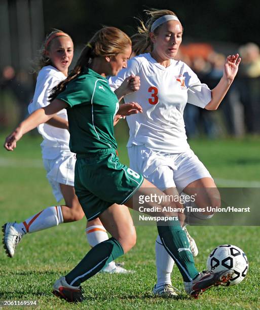 From left, Shenendehowa's Kaitlyn Curly battles for the ball with Bethlehem's Elle Lutz during a soccer game Wednesday, Sept. 19, 2012 in Delmar, N.Y.