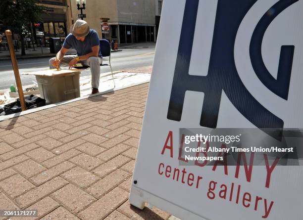 Tony Iadicicco of Albany paints an abstract piece of art on North Pearl street on PARK Day Friday, Sept. 21, 2012 in Albany, N.Y. PARK Day is an...