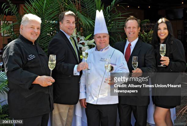 From left, Rick Treacy, executive chef and owner of Michael's Banquet House, Scott Spiro, investor, board member and VP of technology, Dale Miller,...