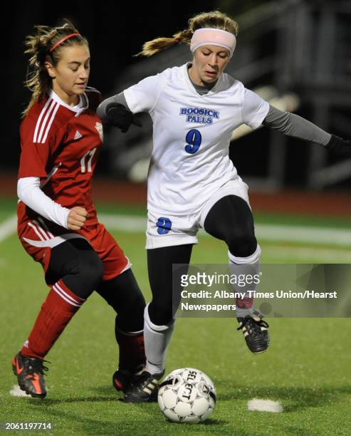 From left, Mechanicville's Renate Gerstenberger battles for the ball with Hoosick Falls' Grace Delurey during the Class C Section II girls' soccer...