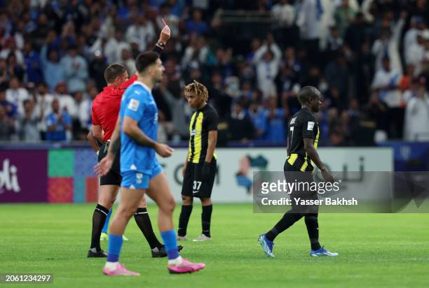Referee Shaun Evans shows a red card to N'Golo Kante of Al Ittihad during the AFC Champions League Quarter Final First Leg match between Al-Hilal and...