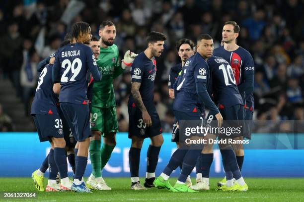 Kylian Mbappe of Paris Saint-Germain huddles with teammates prior to the UEFA Champions League 2023/24 round of 16 second leg match between Real...
