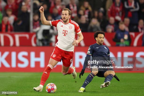 Harry Kane of Bayern Munich is challenged by Felipe Anderson of SS Lazio during the UEFA Champions League 2023/24 round of 16 second leg match...