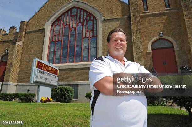 Pastor Ernest Fink stands outside the City Harvest Family Church on Wednesday, July 31, 2013 in Albany, N.Y.