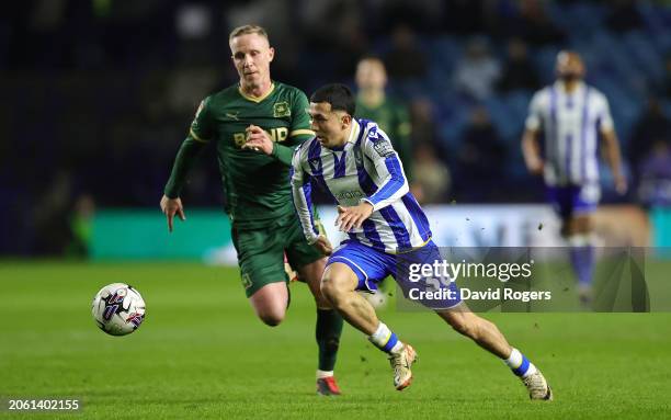 Ian Poveda of Sheffield Wednesday is challenged by Adam Forshaw during the Sky Bet Championship match between Sheffield Wednesday and Plymouth Argyle...