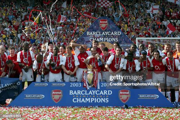 May 15: Arsenal players celebrate with Premiership trophy after becoming the 2003-2004 Premier League champions after winning the Premier League...