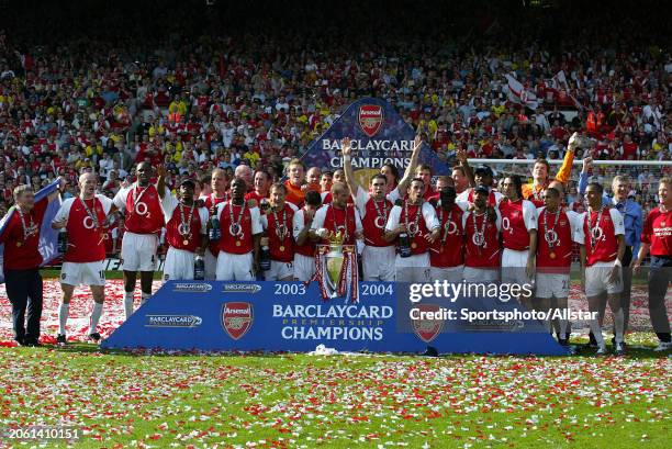 May 15: Arsenal players celebrate with Premiership trophy after becoming the 2003-2004 Premier League champions after winning the Premier League...