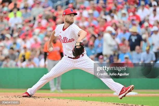 Zack Wheeler of the Philadelphia Phillies delivers a pitch to the Baltimore Orioles in the first inning during a 2024 Grapefruit League Spring...