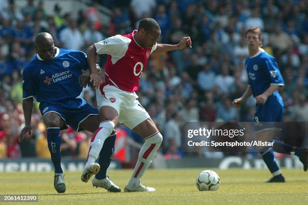 May 15: Frank Sinclair and Theirry Henry challenge during the Premier League match between Arsenal and Leicester at Highbury on May 15, 2004 in...