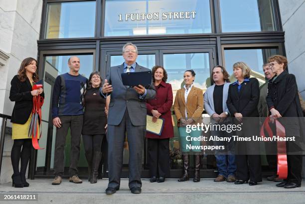 Troy Mayor Lou Rosamilia speaks during a ribbon cutting ceremony for three new stores in the landmark building in Troy Frear's Cash Bazaar building...