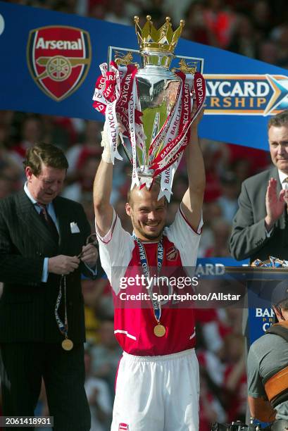 May 15: Fredrik Ljungberg of Arsenal celebrates with the Premier League Trophy after becoming a 2003-2004 Premiership champion after the Premier...