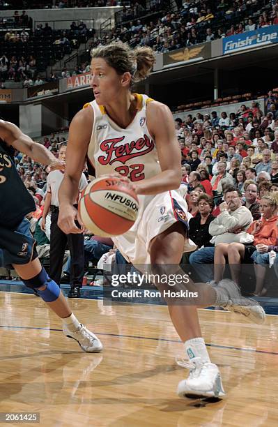 Stephanie White of the Indiana Fever drives against the Washington Mystsics during the WNBA game at Conseco Fieldhouse on May 31, 2003 in...