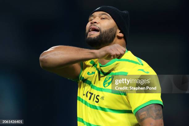 Boxer, Frazer Clarke, reacts towards the fans as he is seen on the pitch wearing a Norwich City FC home shirt as the BBBofC British Heavyweight and...