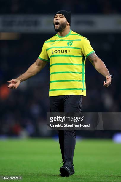 Boxer, Frazer Clarke, reacts towards the fans as he is seen on the pitch wearing a Norwich City FC home shirt as the BBBofC British Heavyweight and...