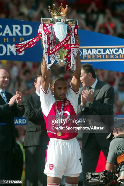 May 15: Thierry Henry of Arsenal celebrates with the Premier League Trophy after becoming a 2003-2004 Premiership champion after the Premier League...