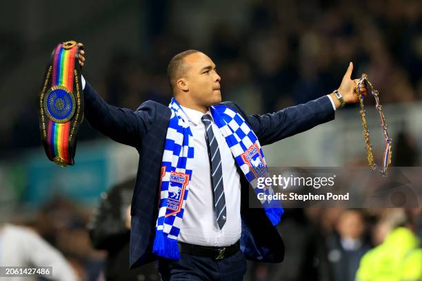 Boxer, Fabio Wardley, acknowledges the fans whilst wearing an Ipswich Town FC scarf as he is seen on the pitch with his belts as the BBBofC British...