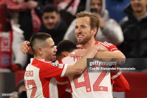 Harry Kane of Bayern Munich celebrates scoring his team's third goal with teammates Raphael Guerreiro and Jamal Musiala during the UEFA Champions...