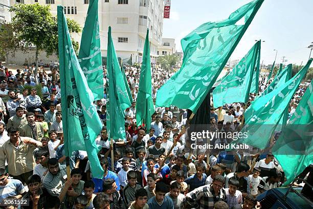 Palestinian supporters of the Islamic militant group Hamas chant anti-Israeli and anti-American slogans during demonstrations against the Middle East...