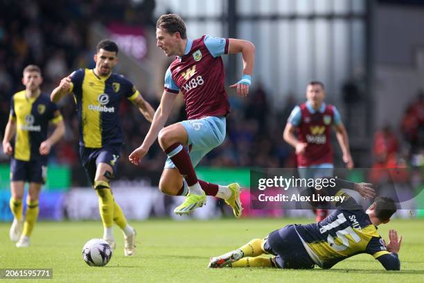 Sander Berge of Burnley is challenged by Adam Smith of AFC Bournemouth during the Premier League match between Burnley FC and AFC Bournemouth at Turf...