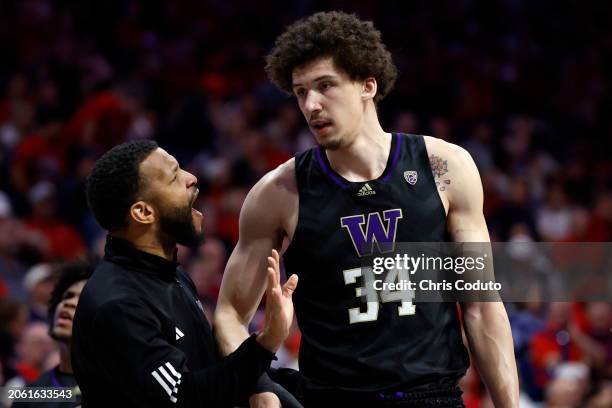 Associate head coach Will Conroy talks with Braxton Meah of the Washington Huskies during the game against the Arizona Wildcats at McKale Center on...