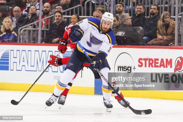 St. Louis Blues right wing Kevin Hayes skates with the puck during a game between the St. Louis Blues and New Jersey Devils on March 7, 2024 at...