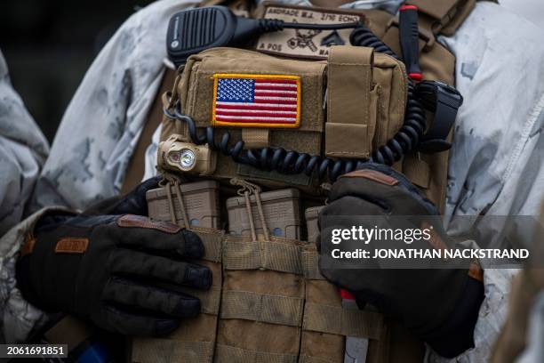 Soldier from the 2nd Battalion, 10th Marines Regiment, with a badge of the USA flag on his gear, participates in the Nordic Response 24 military...