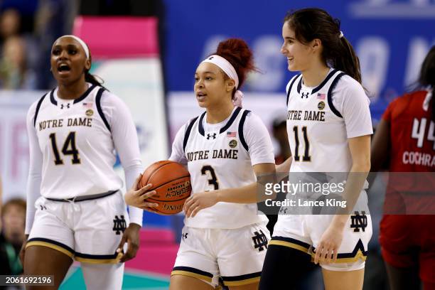 Bransford, Hannah Hidalgo and Sonia Citron of the Notre Dame Fighting Irish celebrate following their victory against the Louisville Cardinals in the...
