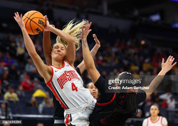 Jacy Sheldon of the Ohio State Buckeyes get fouled by Brinae Alexander of the Maryland Terrapins as Riley Nelson of the Maryland Terrapins defends in...