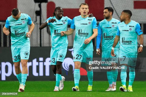 Montpellier's players celebrates their first goal during the French L1 football match between OGC Nice and Montpellier Herault SC at the Allianz...