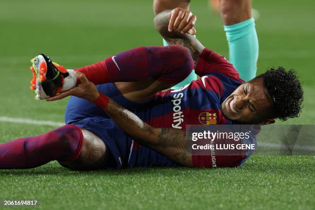 Barcelona's Brazilian forward Raphinha reacts on the pitch during the Spanish league football match between FC Barcelona and RCD Mallorca at the...