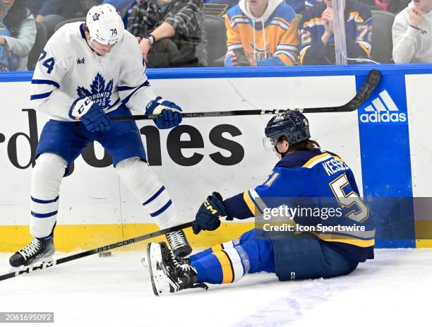 Toronto Maple Leafs center Bobby McMann goes after a loose puck after St. Louis Blues defenseman Matt Kessell falls to the ice during a NHL game...