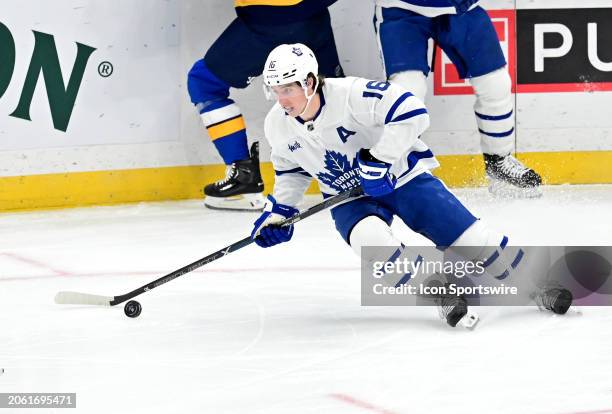 Toronto Maple Leafs right wing Mitchell Marner controls the puck during a NHL game between the Toronto Maple Leafs and the St. Louis Blues on...