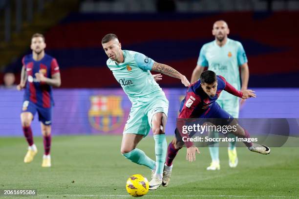 Matija Nastasic of Real Mallorca, Joao Cancelo of FC Barcelona during the LaLiga EA Sports match between FC Barcelona v Real Mallorca at the Lluis...