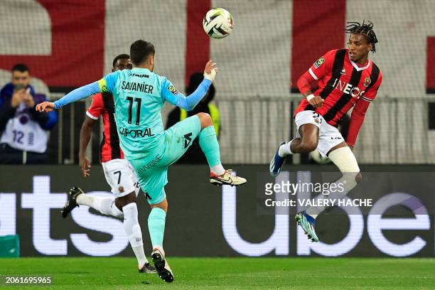 Montpellier's French midfielder Teji Savanier fights for the ball with Nice's Algerian defender Hicham Boudaoui during the French L1 football match...